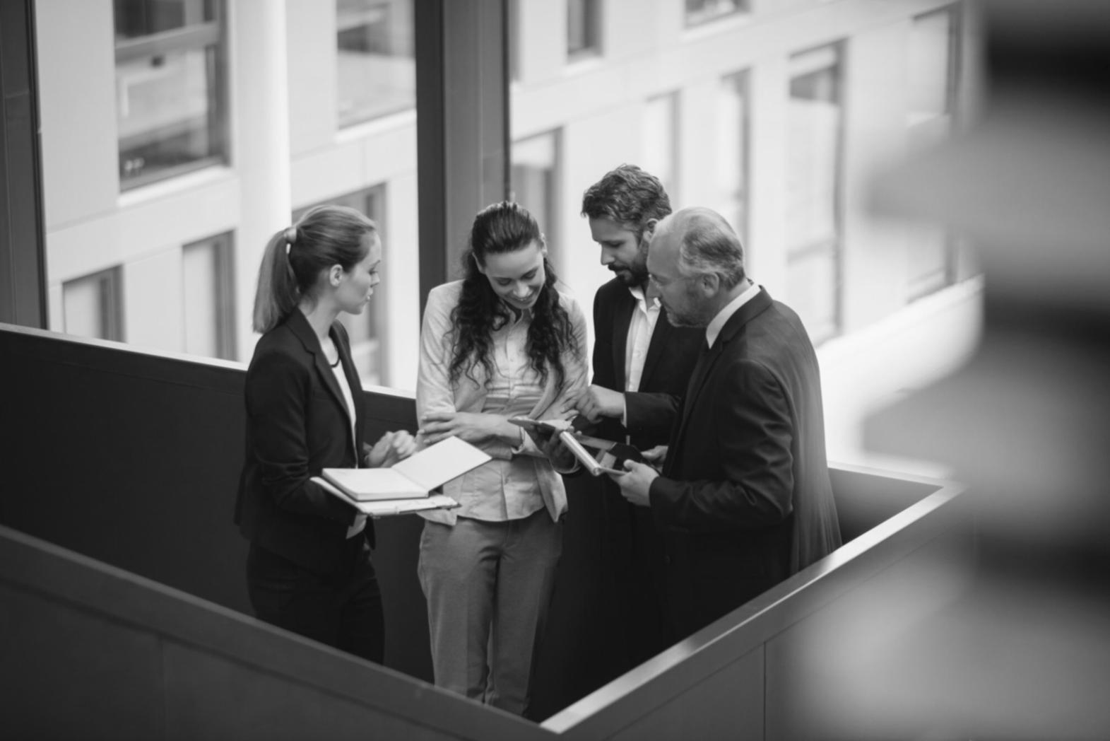 Business professionals analyzing financial forecasting data and market trends